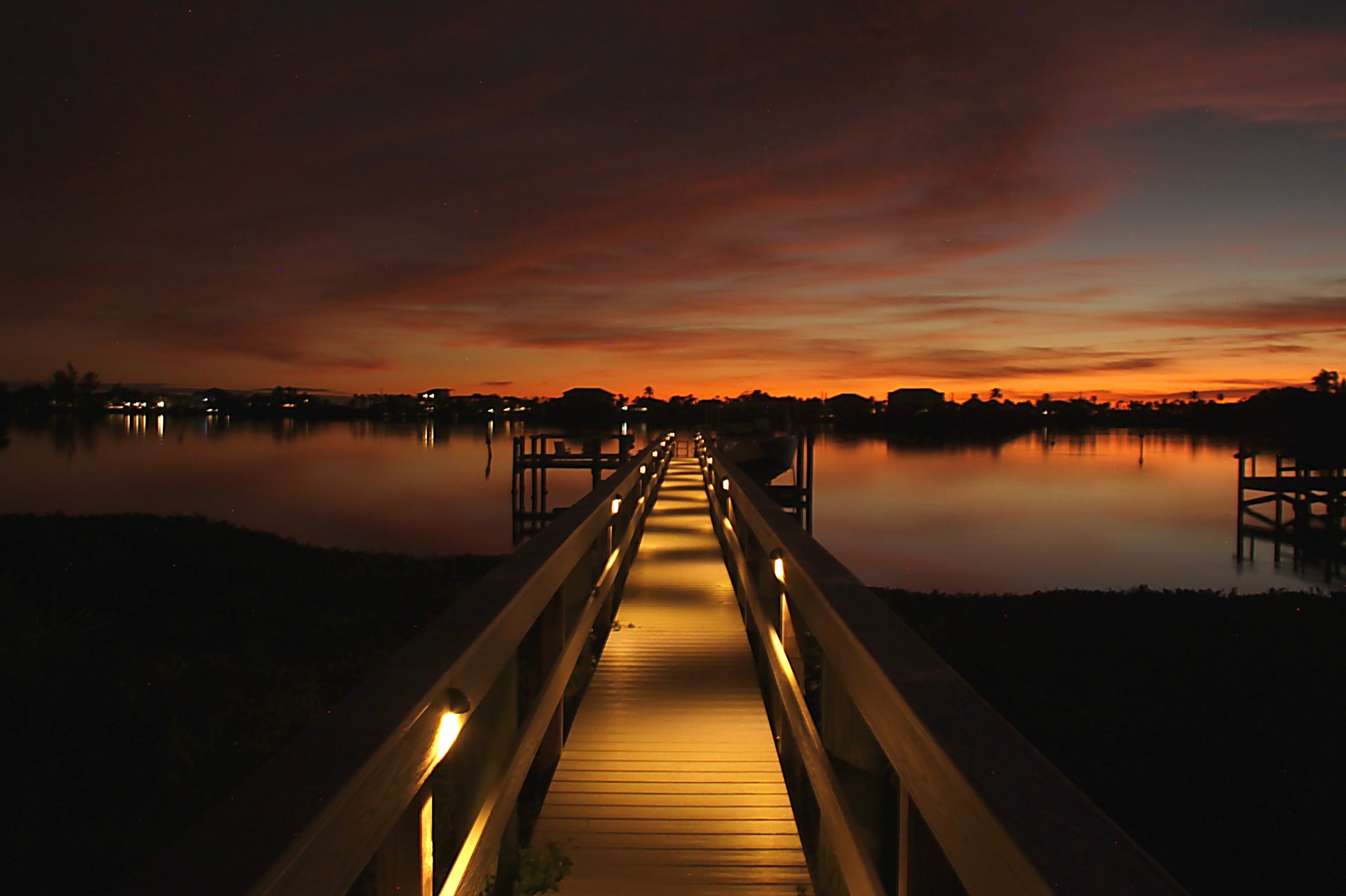Warm landscape lighting creating inviting outdoor atmosphere